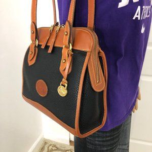 Vintage Dooney & Bourke black / brown leather Shoulder Bag .